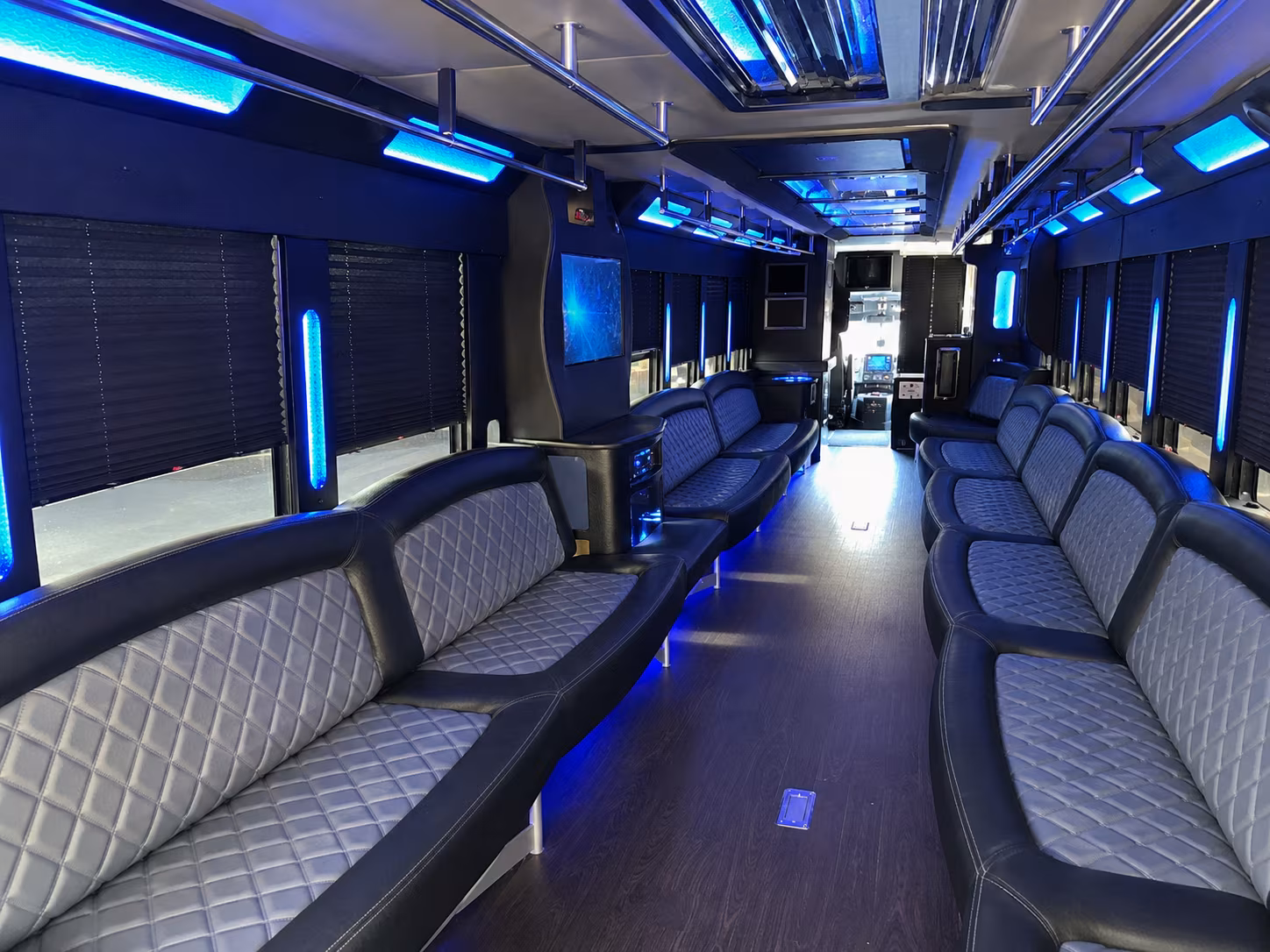 Friends laughing during a party bus celebration in Fort Lauderdale